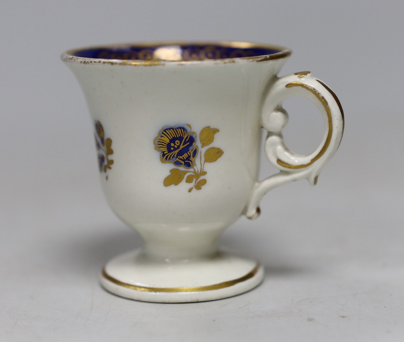 A Caughley rare ice or sorbet cup decorated in blue and gilt, S mark. 6cm tall